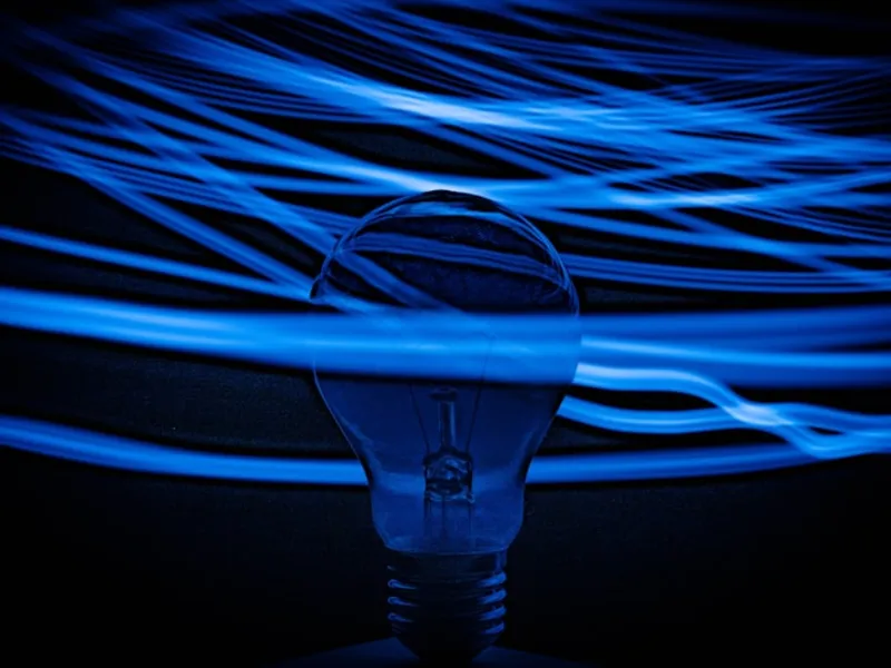Abstract blue and white light streams representing connected intelligence networks