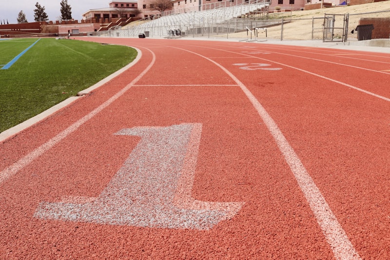 A red track with a white arrow painted on it