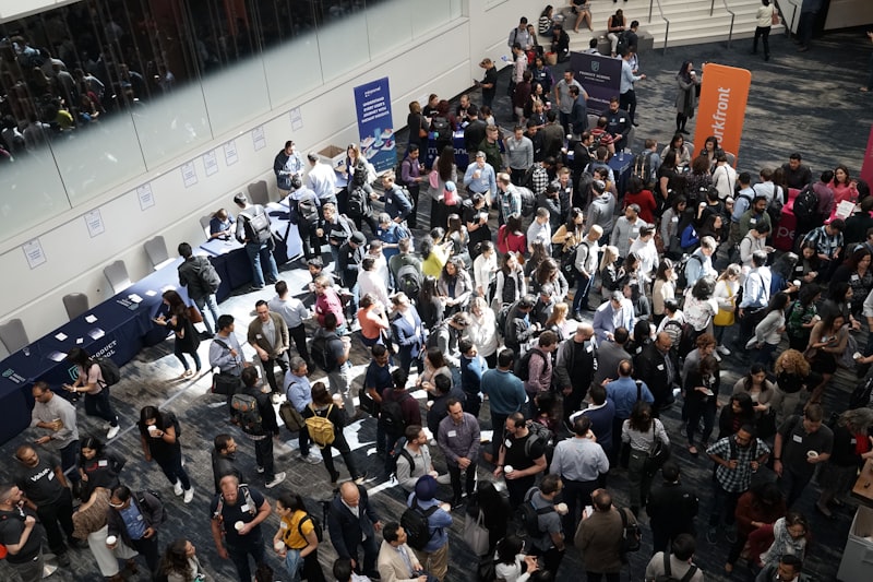 Crowd of people in a building lobby